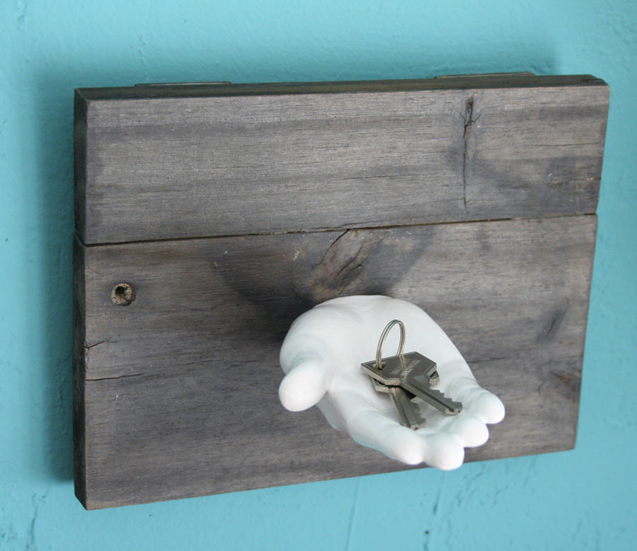 white ceramic hand key holder for wall with wooden plank