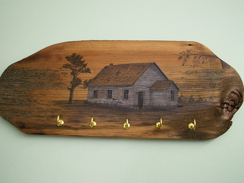 wooden key rack with a country home painting