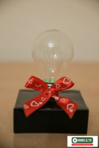 DIY gift idea from recycle electrical light bulb decorated with red ribbon