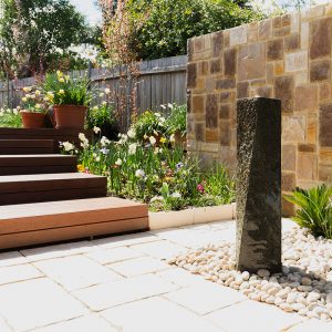 Deakin Gardener Garden broad timber steps with a stone