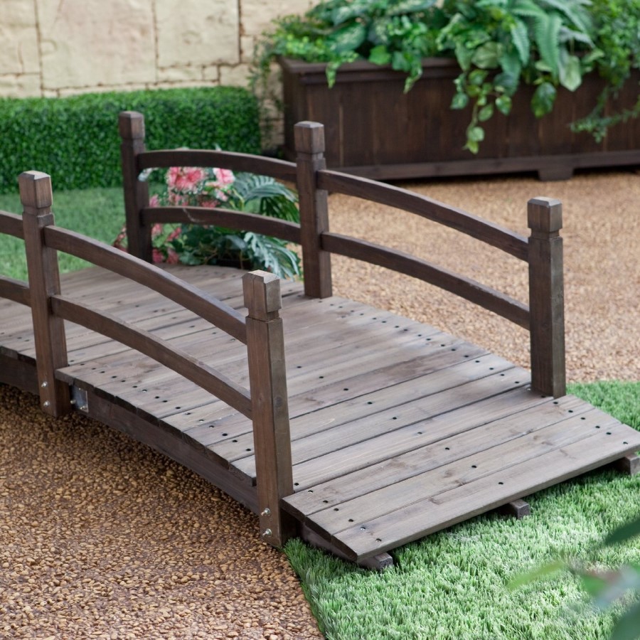 a small bridge in a zen garden