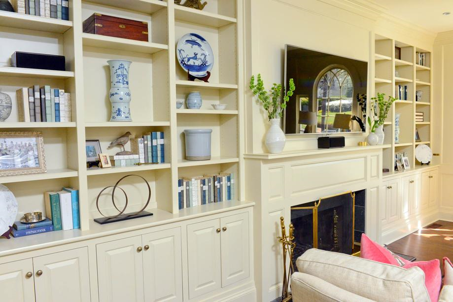 bright build-in bookshelves pained in Elephant Tusk Color in this 1920s vintage home