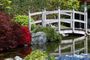 classic wooden bridge in a zen garden for home