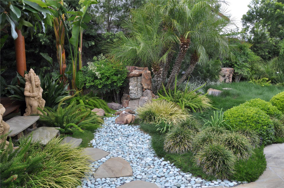 contemporary stone and statue in a Zen garden