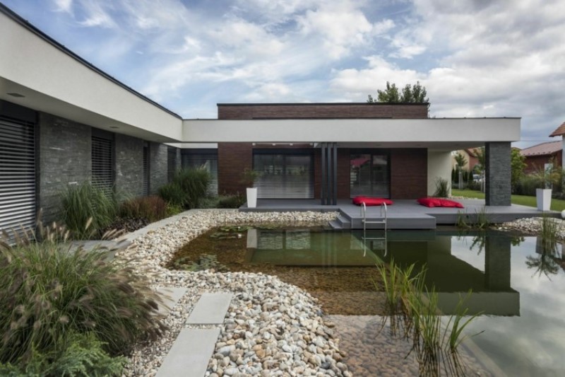 modern house with contemporary japanese garden design with water pond and flower
