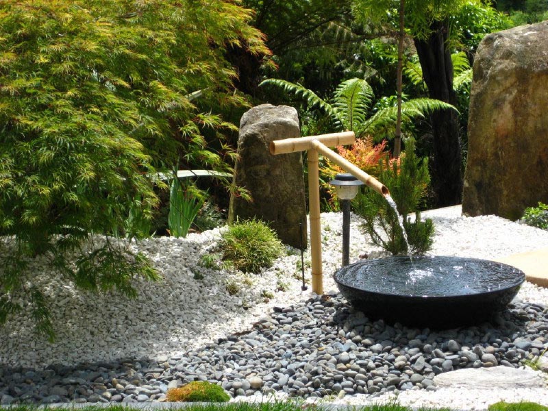 water fountain in a contemporary japanese garden design