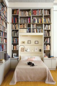 built in bookshelves into the wall next to your bed