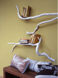 tree branch bookshelf on a yellow wall