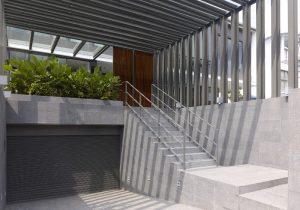 car garage with staircase toward the front gate - Singapore architects