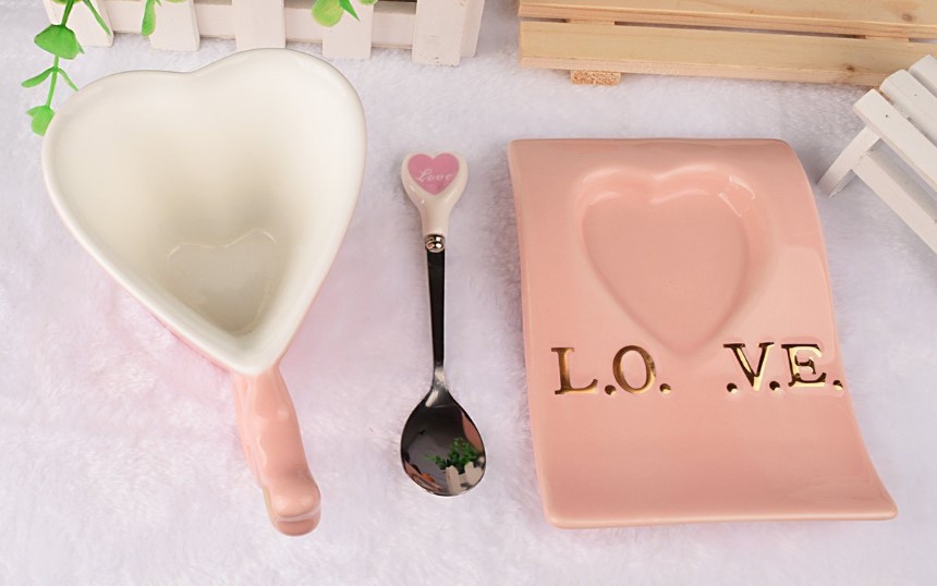 ceramic pink heart shaped mug with love sign spoon and saucer