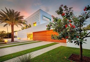 florida home with view at dusk during twilight of its front lawn