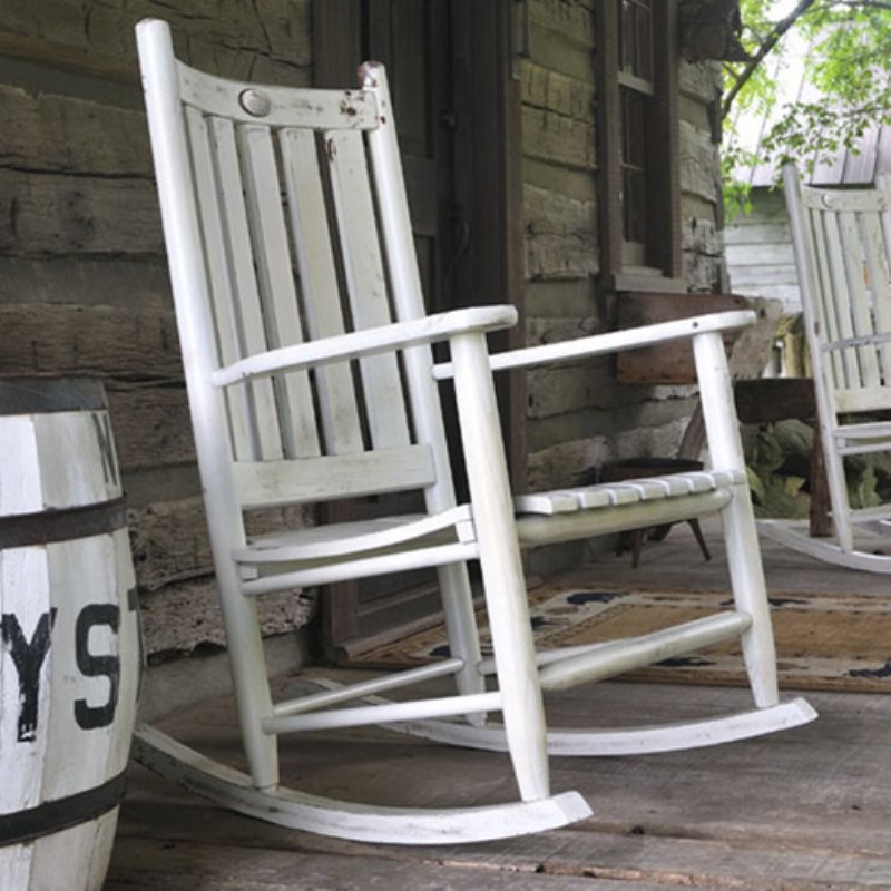 outdoor wooden rocking chair painted in white