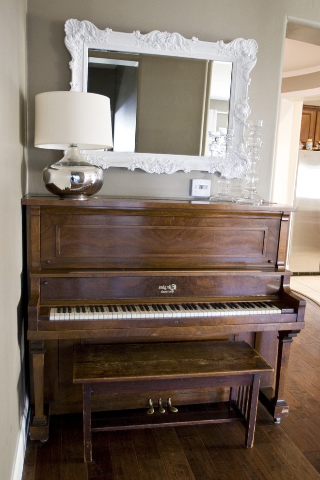 classical upright piano placement near to the hallway