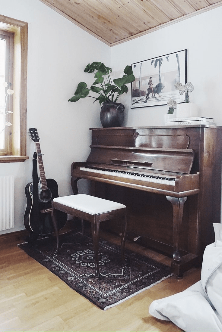 ideal placement of an acoustic upright piano in a corner of a living room