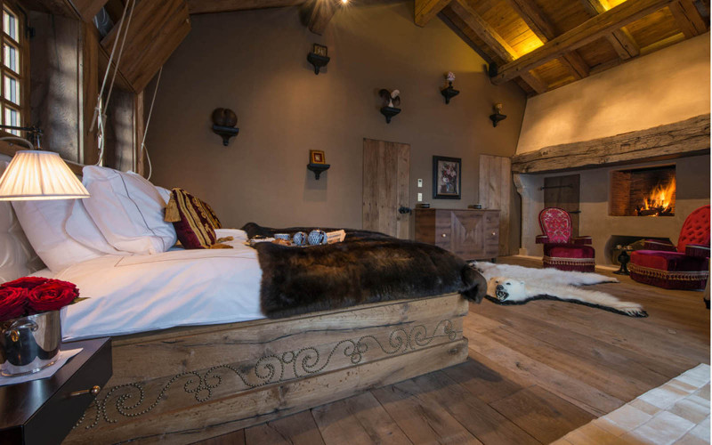 polar bear rug and a swiss bed in a mountain chalet interior decor style