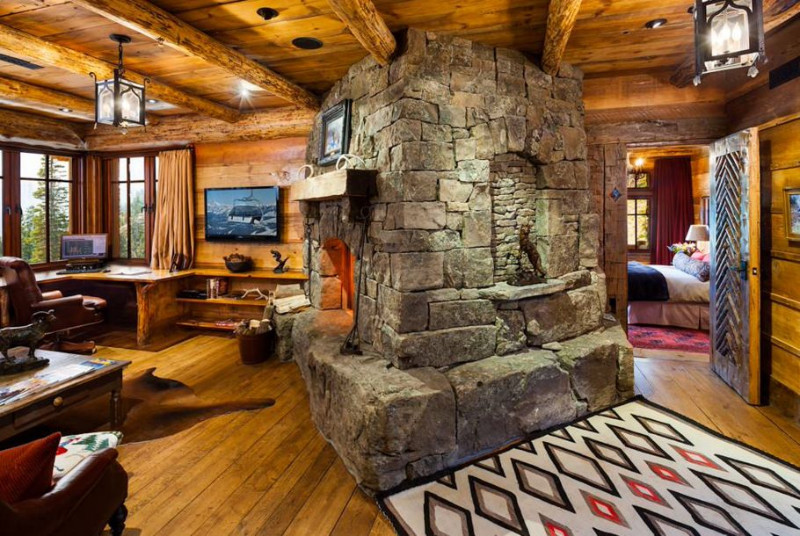stone fireplace in a swiss chalet on top of a remote mountain