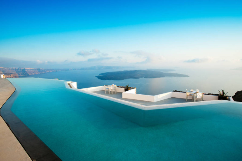 Greece Santorini rooftop pool overlooking the open sea and deep blue sky