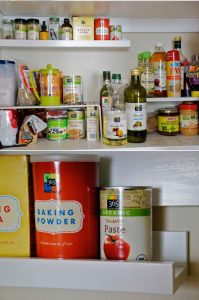 kitchen hack using photo display ledge for maximize pantry space
