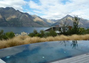 tiny queenstown infinity pool over looking mountaint