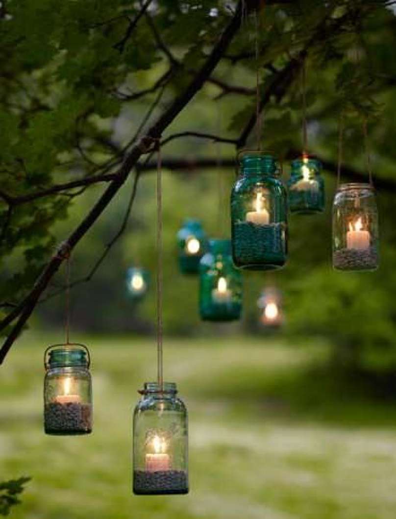 mason jar candle lighting on the tree