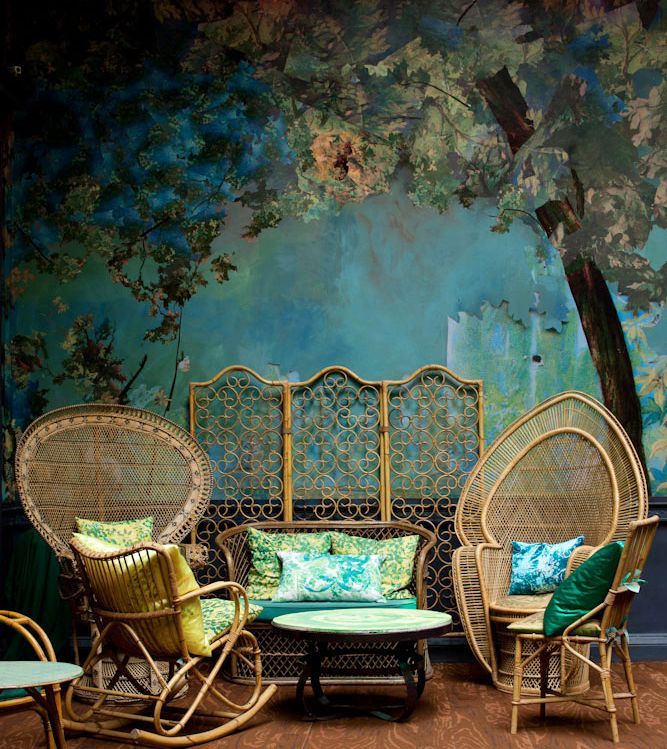 a chinoiserie painted wall with peacock chiar